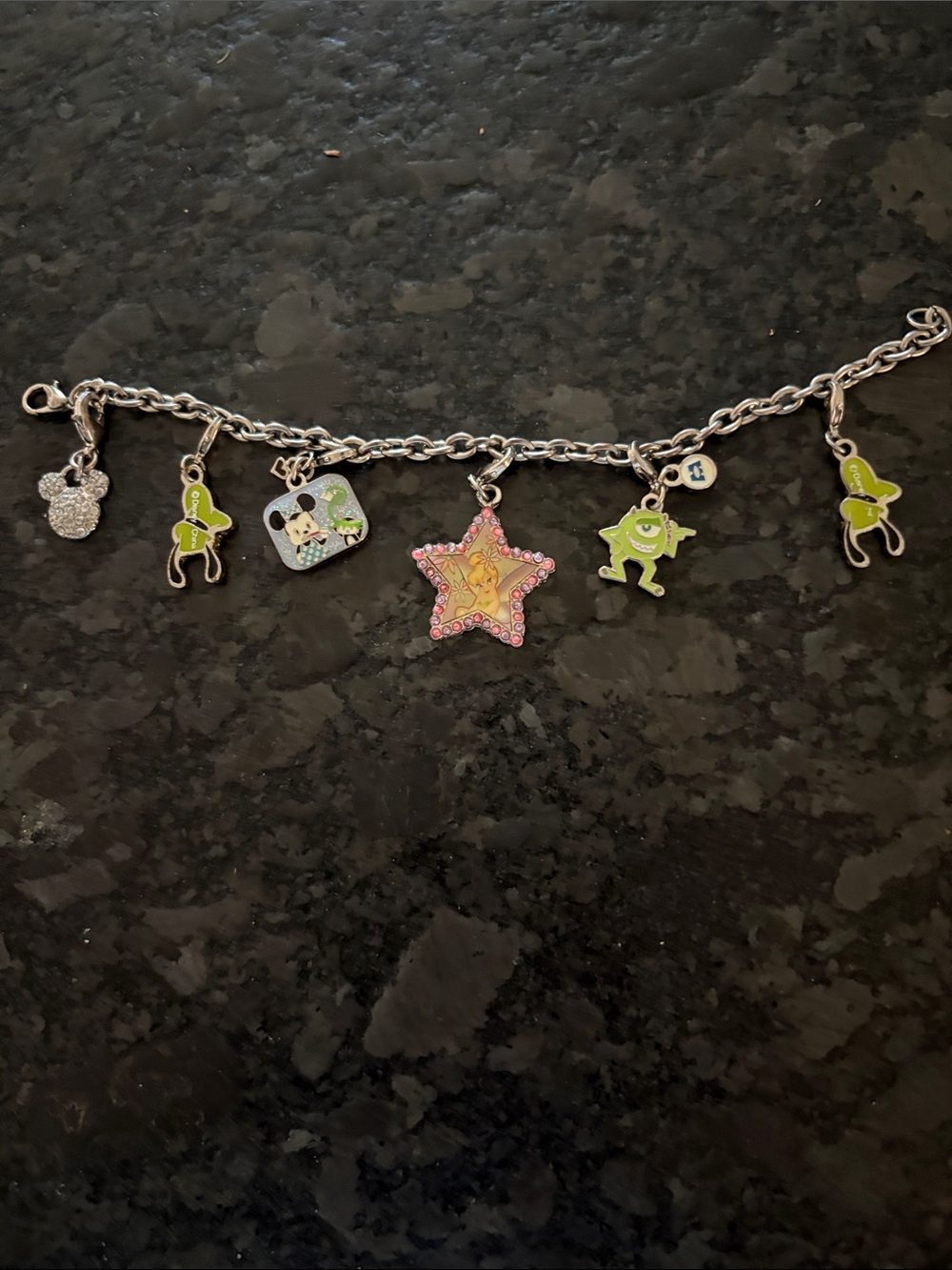 Disney Kids Silver Charm Bracelet with 6 charms measures 6 inches length